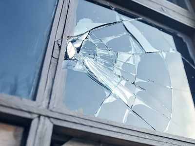 Office window damaged in natural disaster